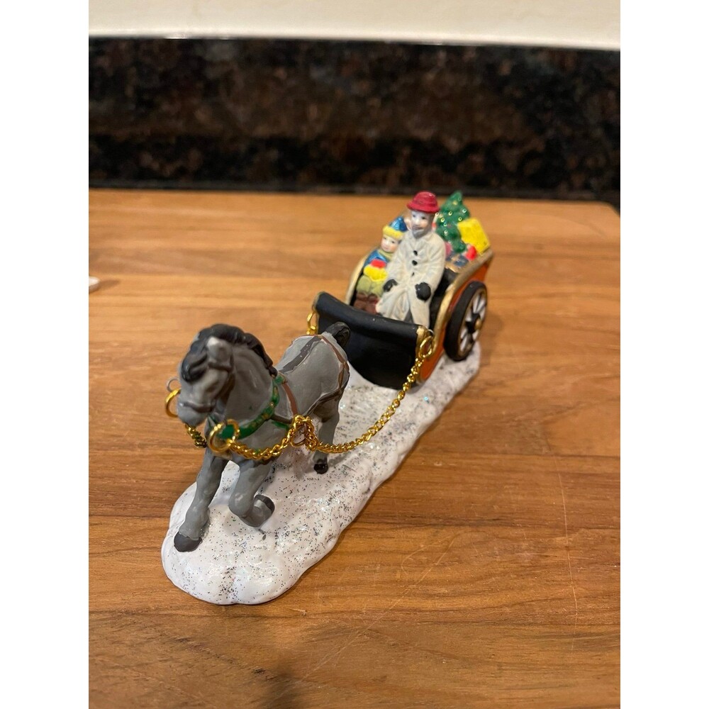 Christmas village sleigh with chains and a horse